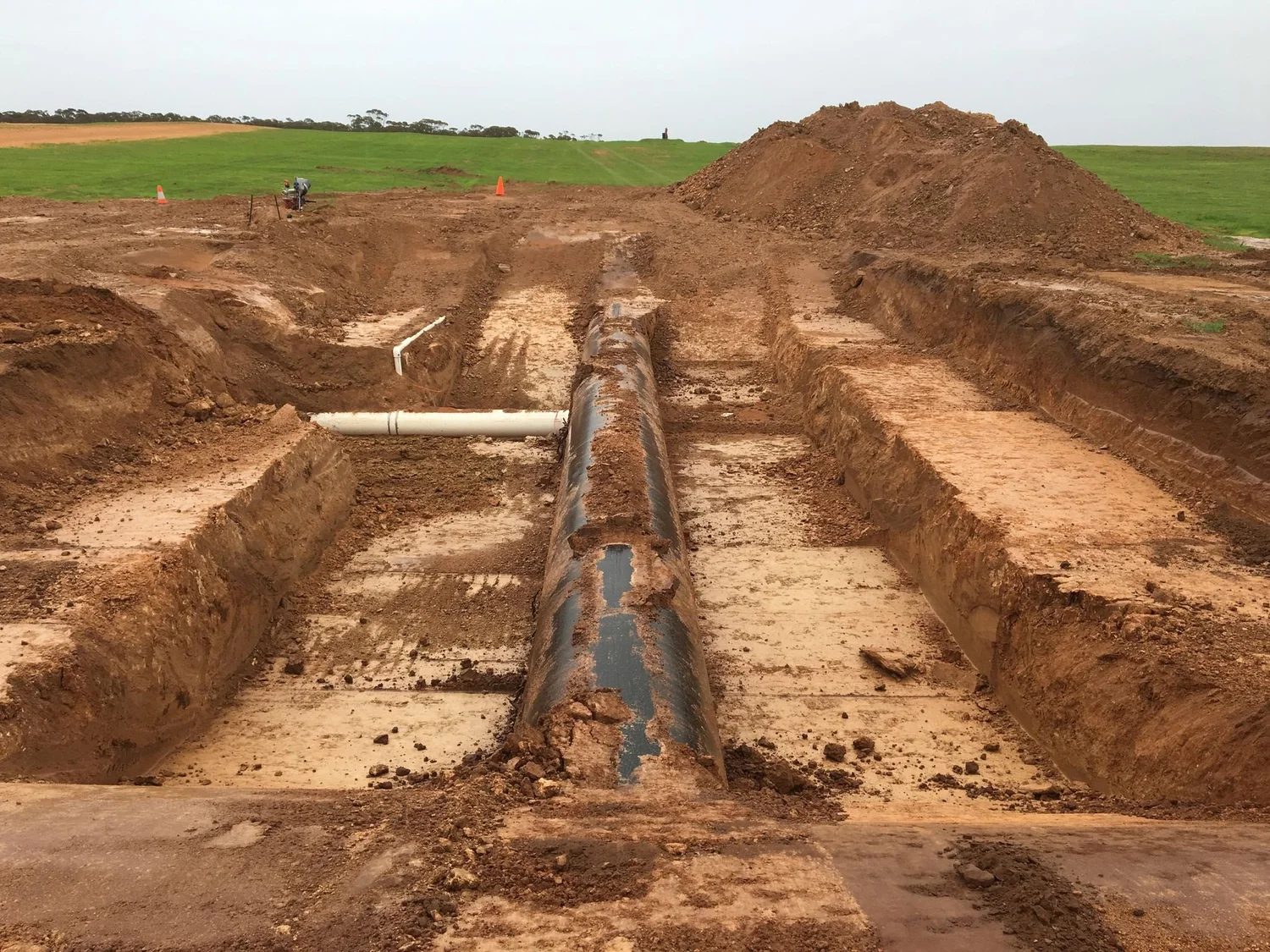 Large irrigation mainline under construction across agricultural land